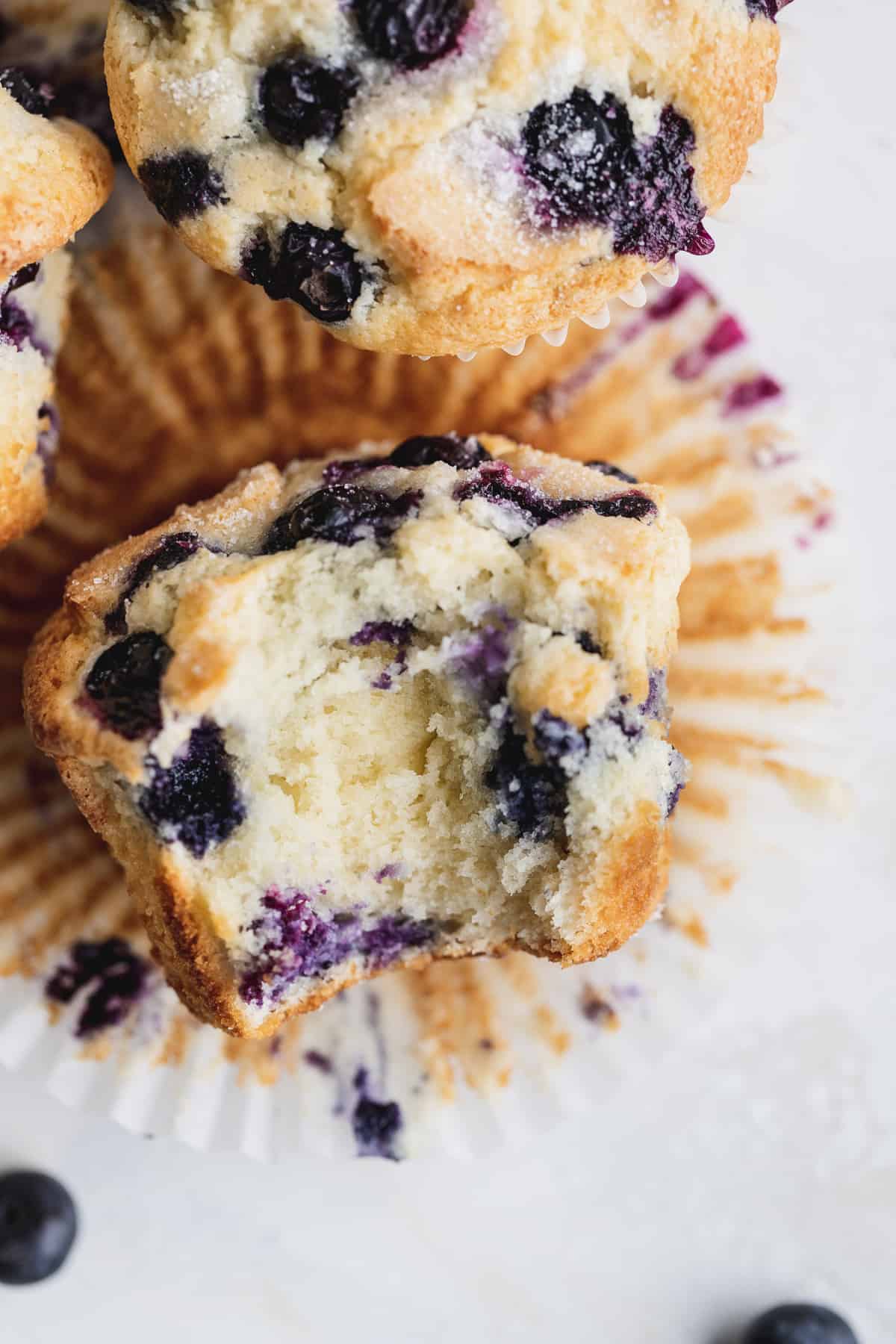 Top view of jumbo blueberry muffin missing a bite.