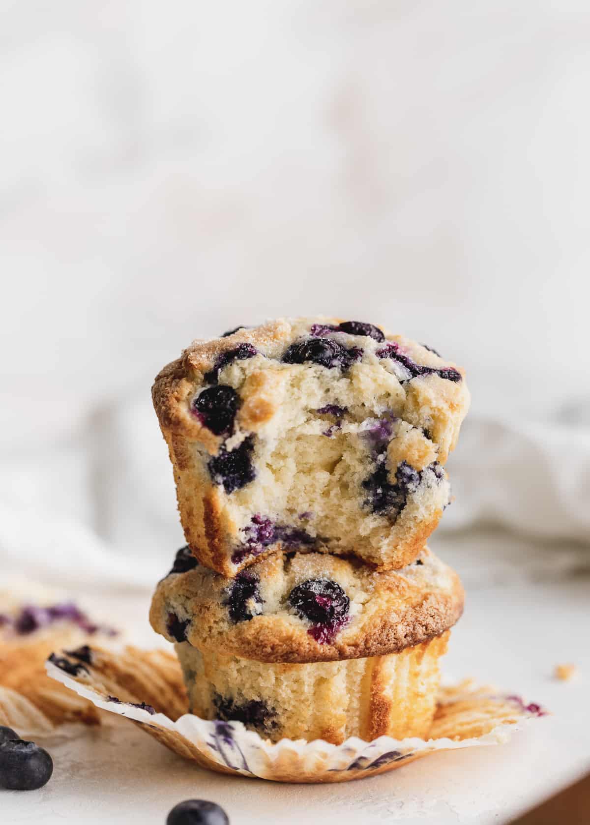 Stacked muffins on a wrapper.