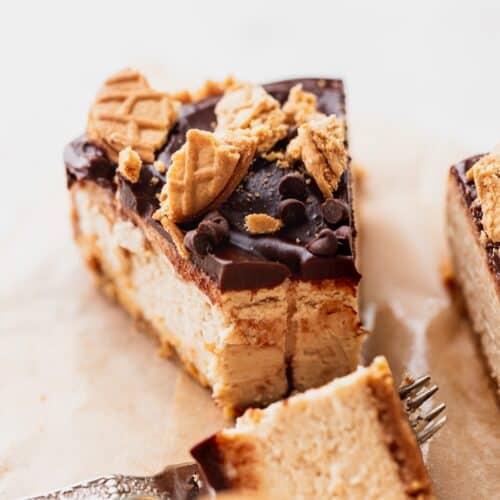 Slice of peanut butter cheesecake with a bite missing.