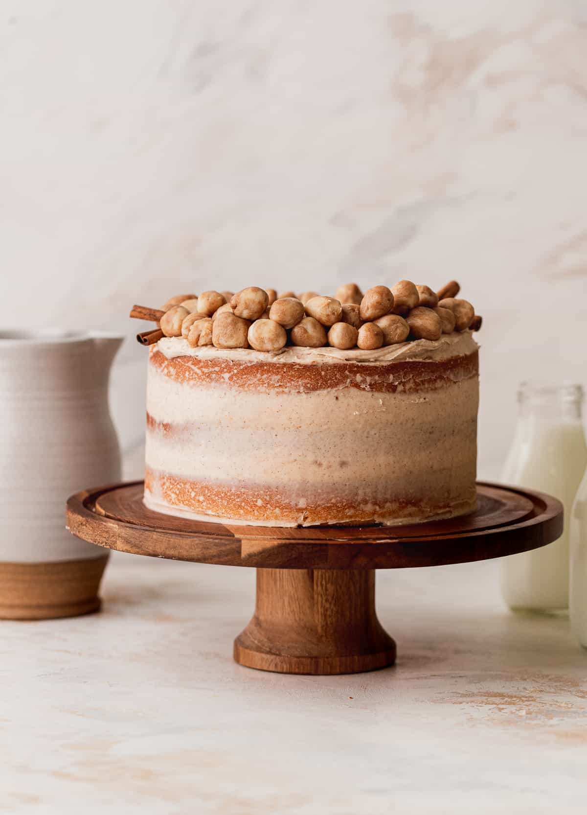 Snickerdoodle cake on a cake stand.