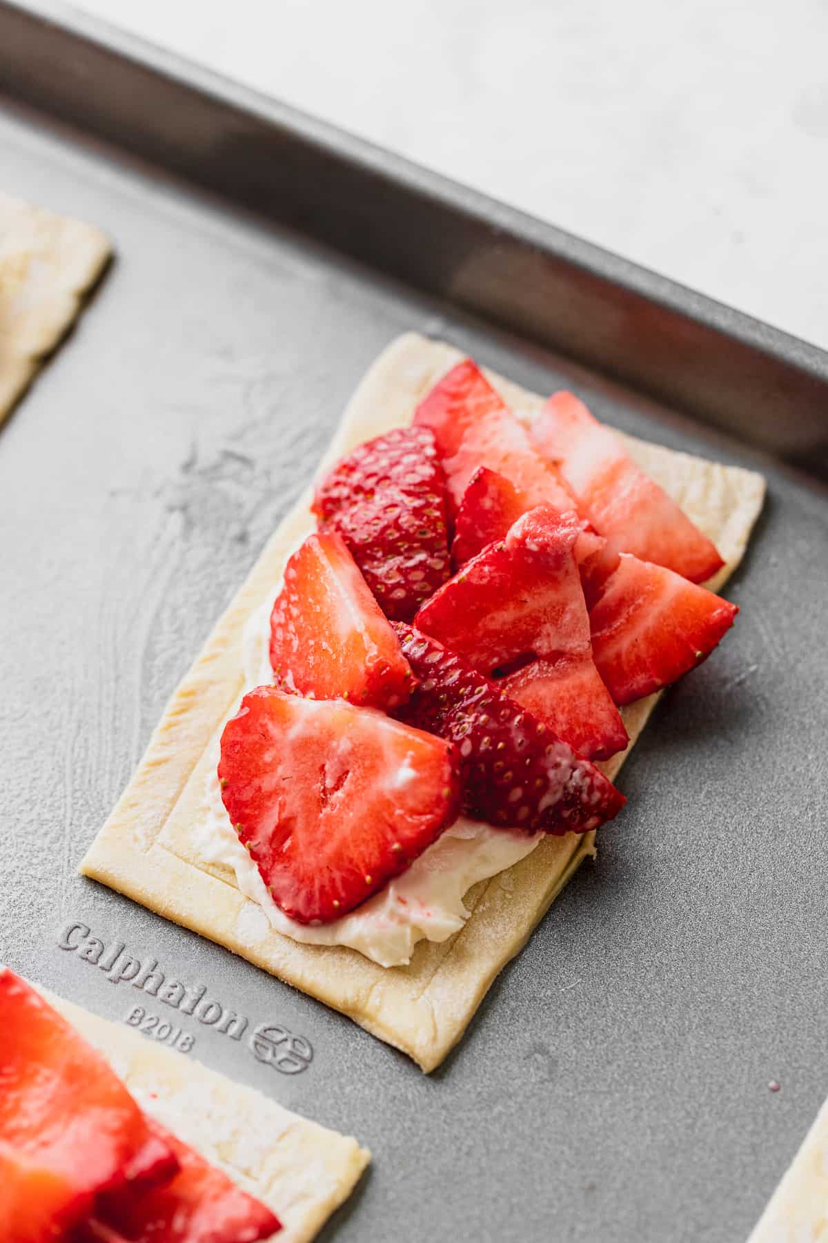 Strawberries on top of pastry.