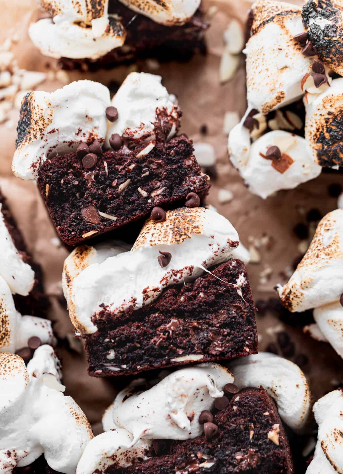 Rocky road cookie bars on its side with toasted marshmallows.