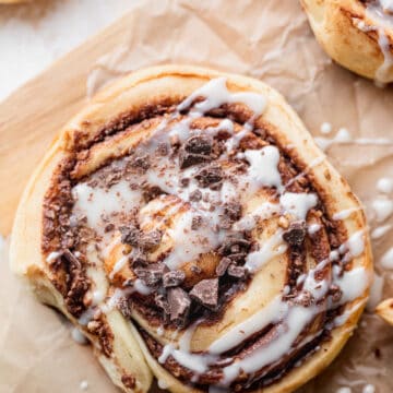 Nutella swirl roll with vanilla icing on top.