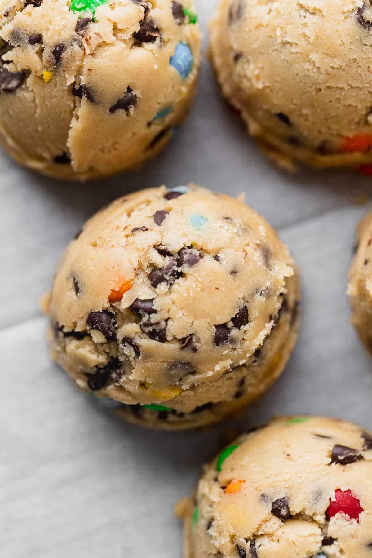 Cookie dough balls on cookie sheet.