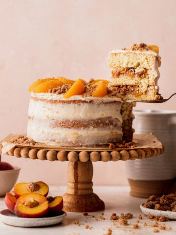 Taking a slice out of peach cake.
