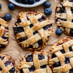 Close up of mini blueberry pies.