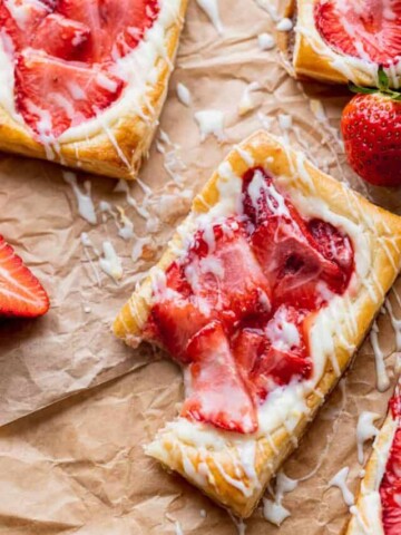 A bite missing with strawberries around it.