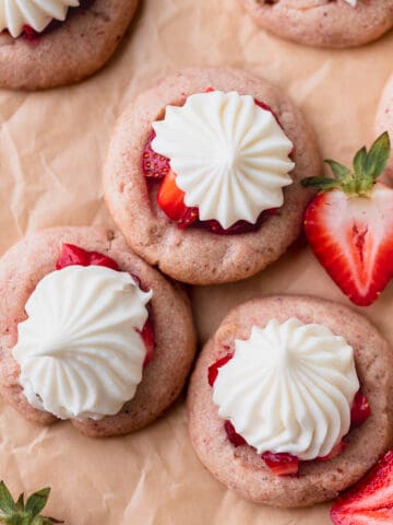 Strawberry cheesecake cookies on parchment paper.