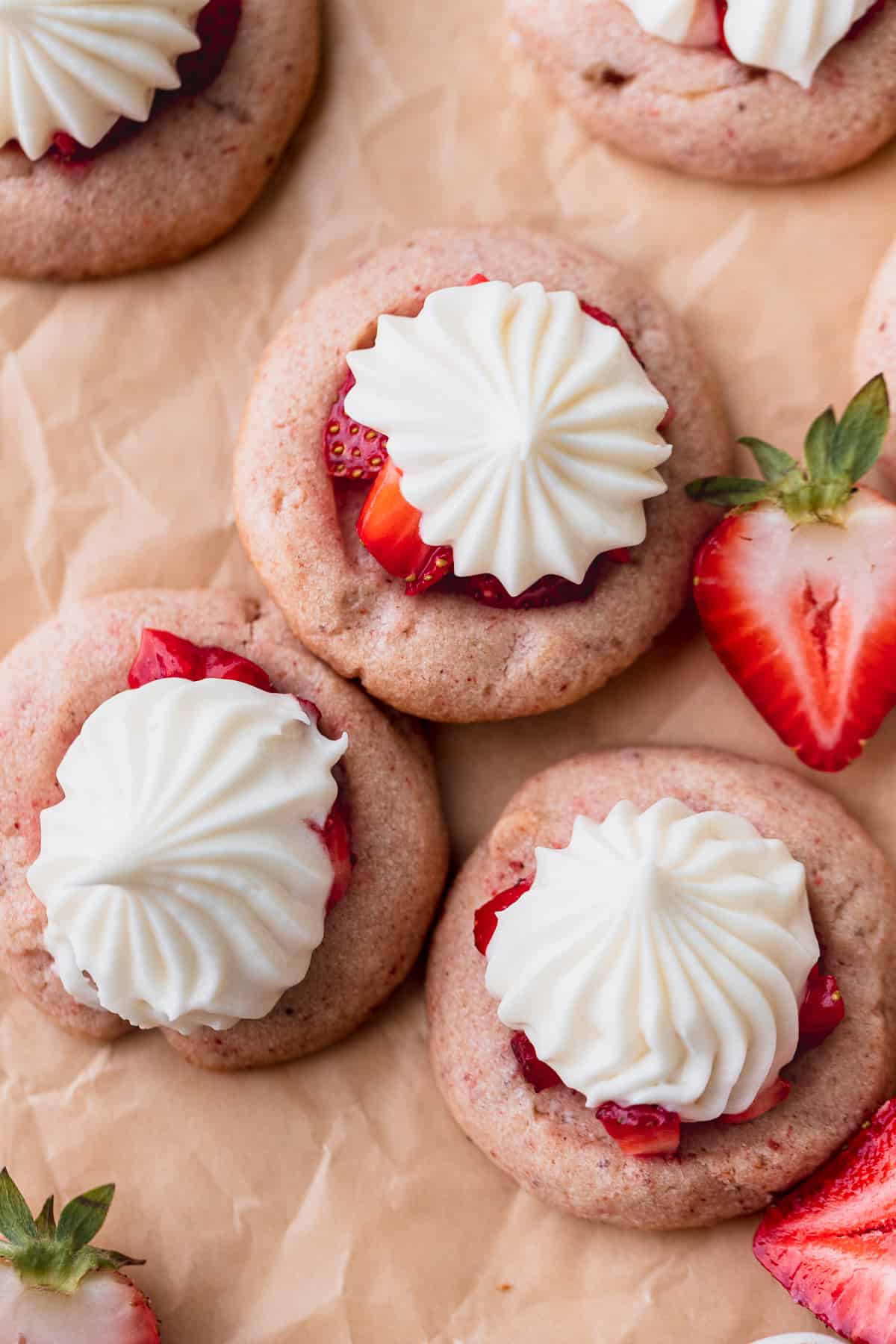 Strawberry cheesecake cookies on parchment paper.
