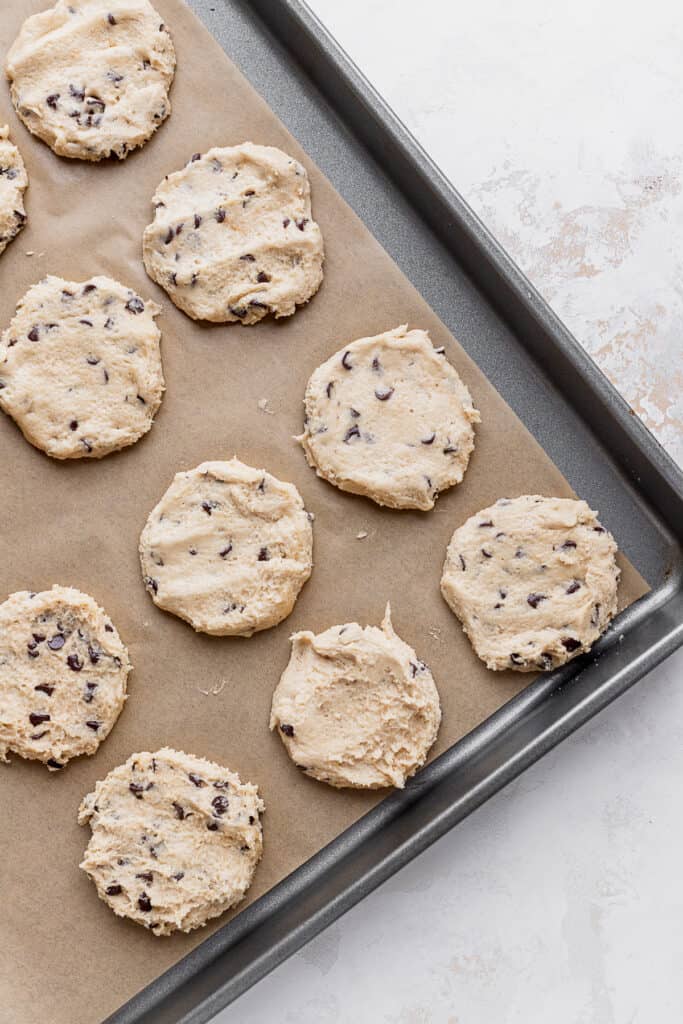 Cookie dough discs on cookie sheet.