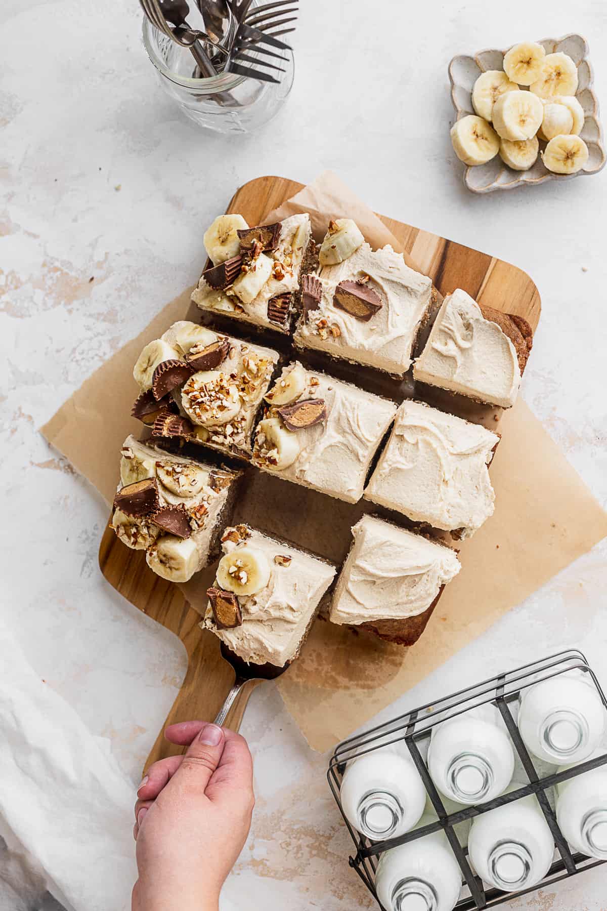 Pulling a slice out of the cake.