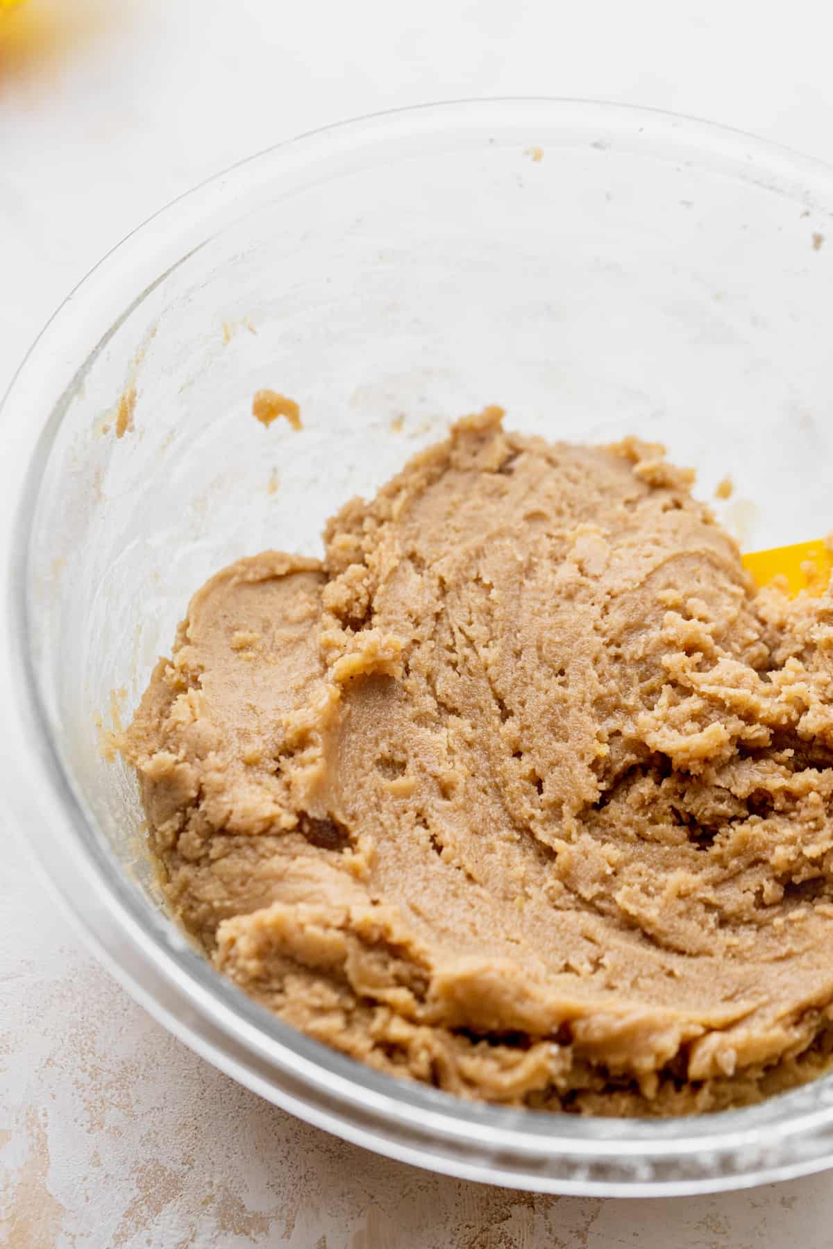 Cookie dough in glass bowl.