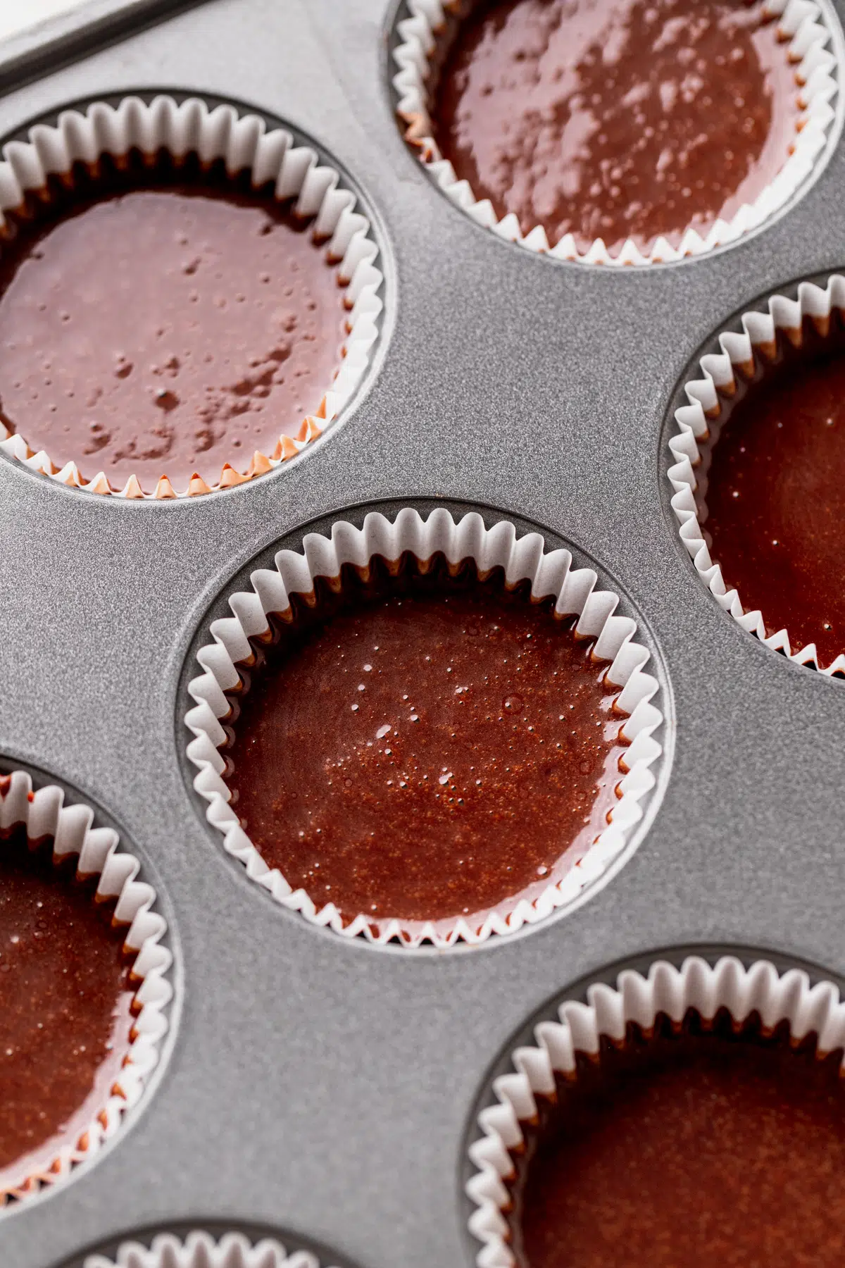 Cupcake batter in muffin tins.