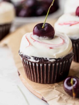 Black Forest cupcake on a wooden board.