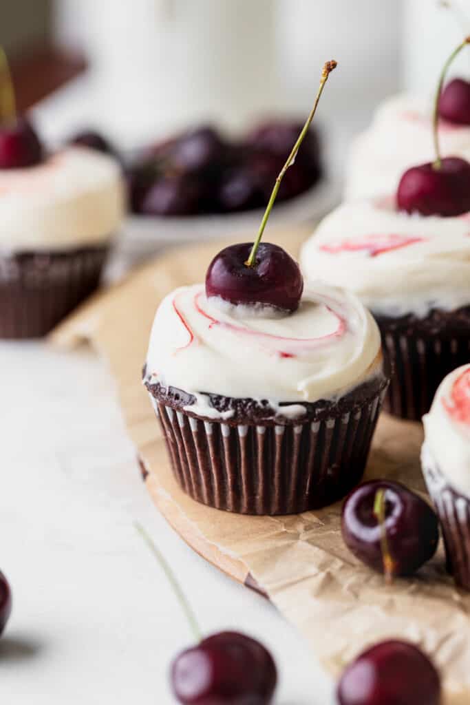 Black Forest cupcake on a wooden board.