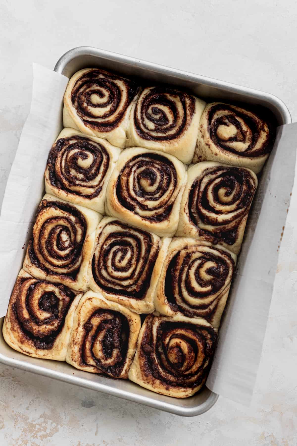 Baked cinnamon rolls in a pan.