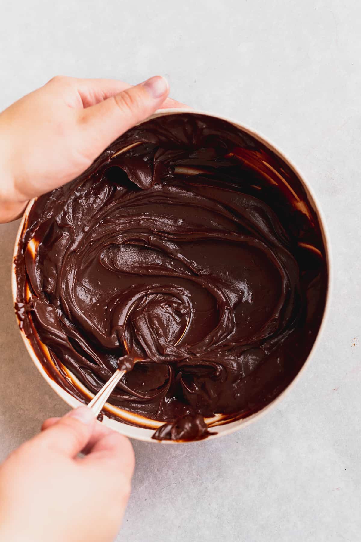 Chocolate frosting in bowl.