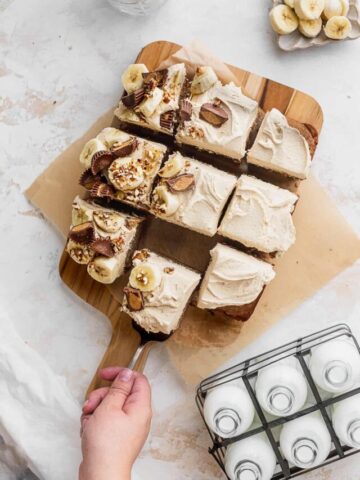 Pulling a slice out of the cake.