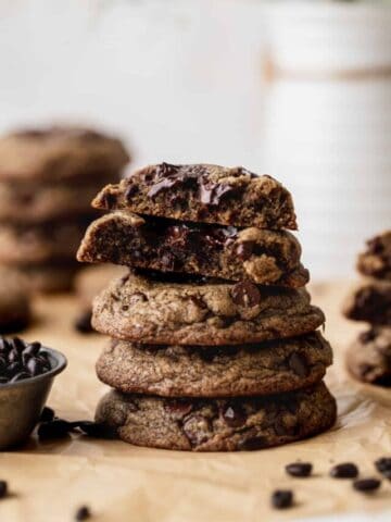Stack of cookies with 1 cut in half.