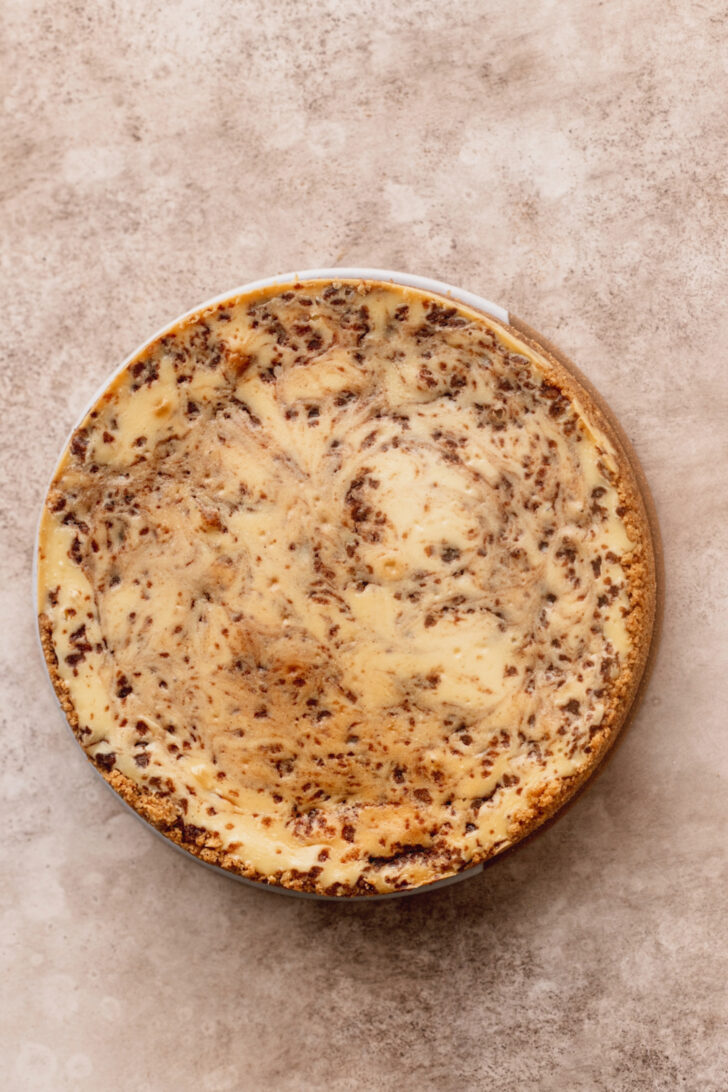 Baked cheesecake on a platter.