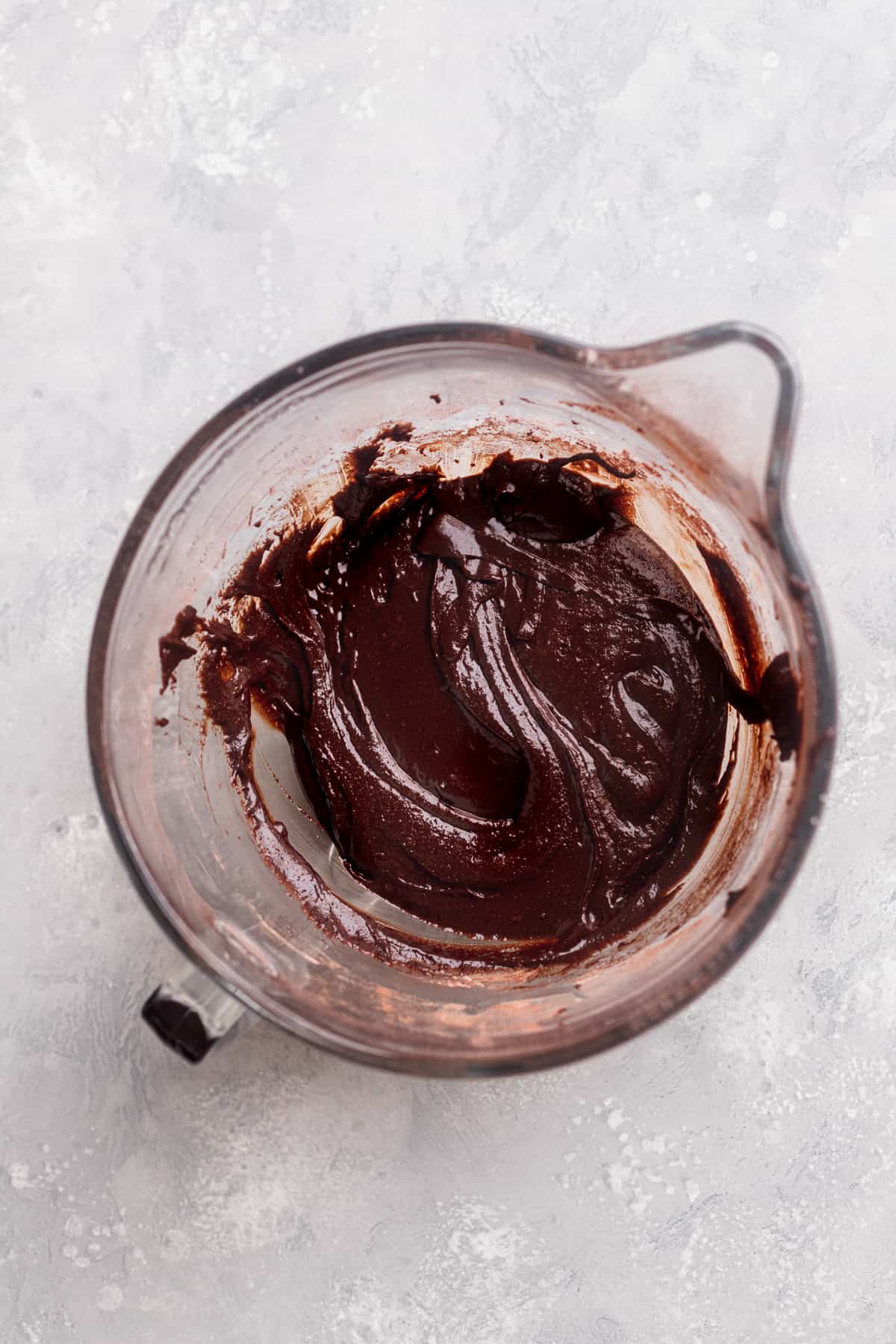 Brownie batter in glass bowl.