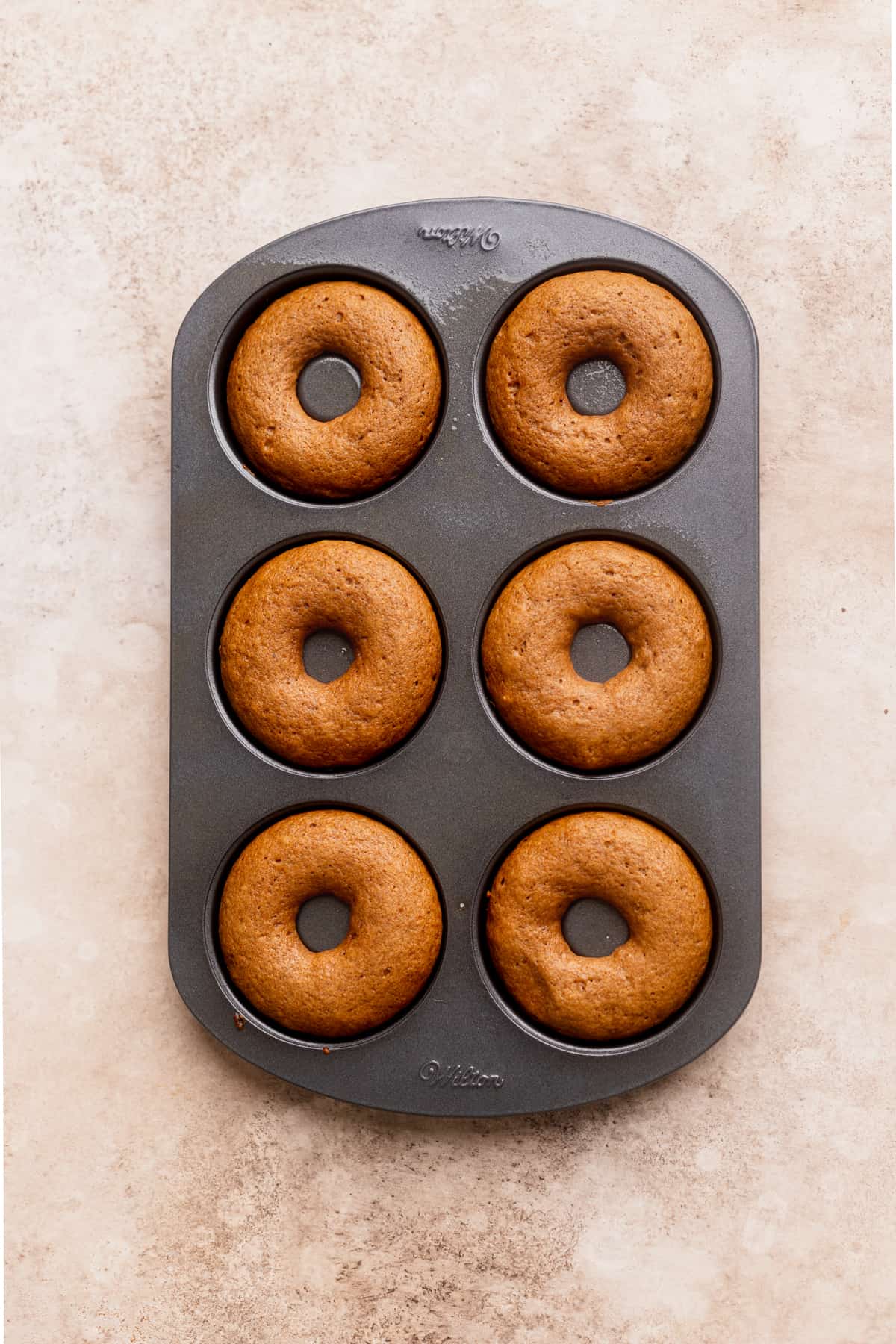 Donuts baked in donut pan.