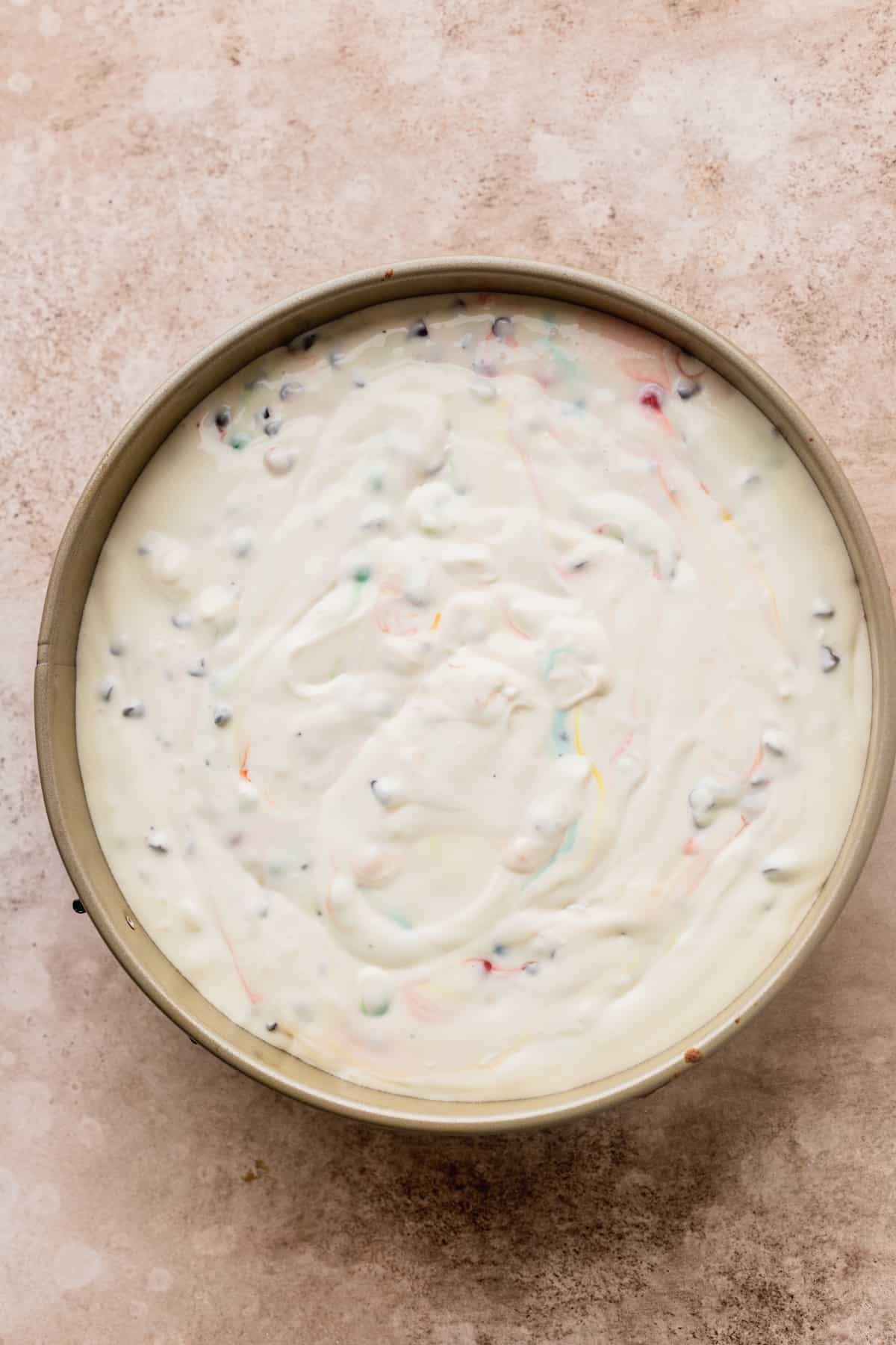 Cheesecake batter in a springform pan.