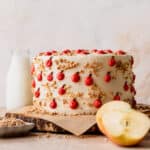 Apple toffee layered cake on a wooden board.