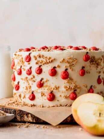 Apple toffee layered cake on a wooden board.