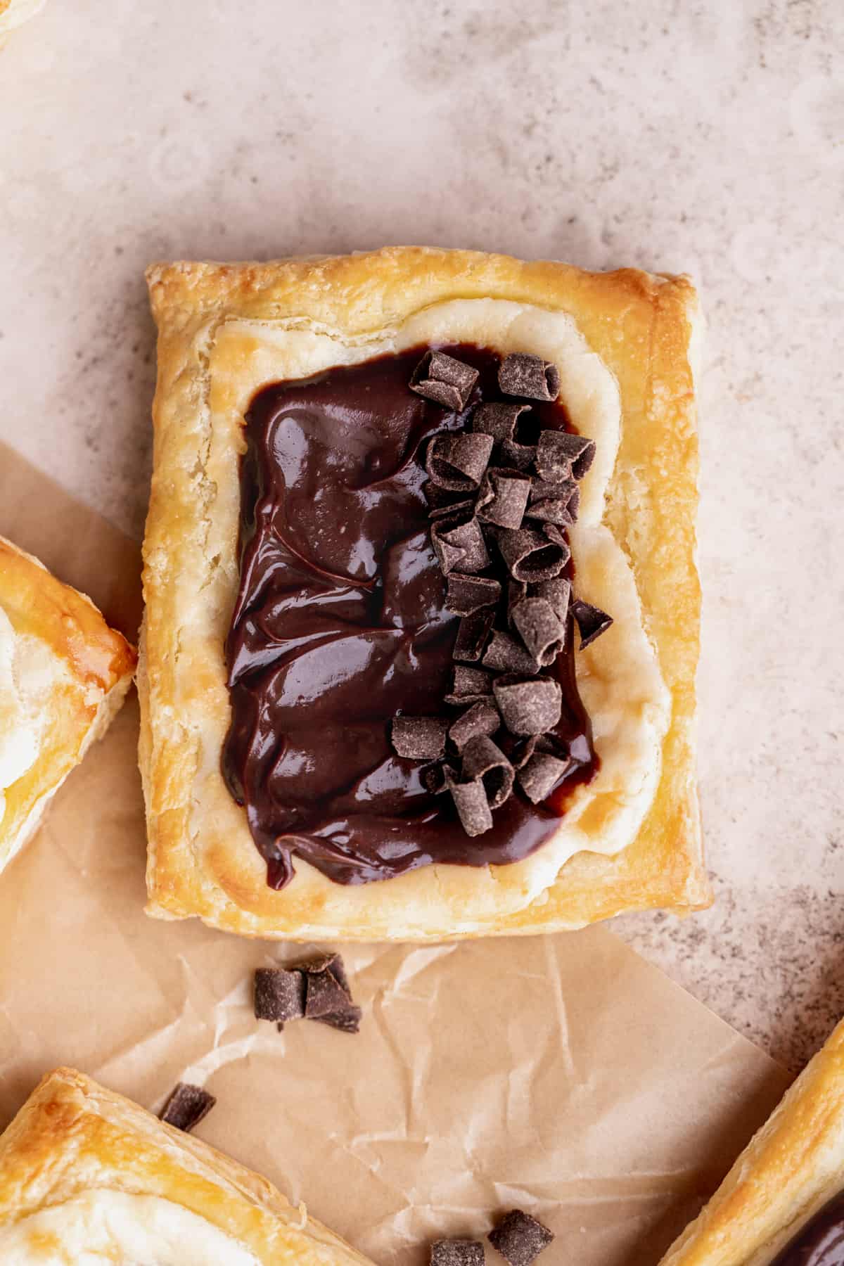 Pastry with chocolate curls on top.