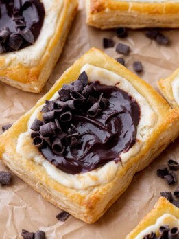 Chocolate cream cheese danish on a parchment paper.