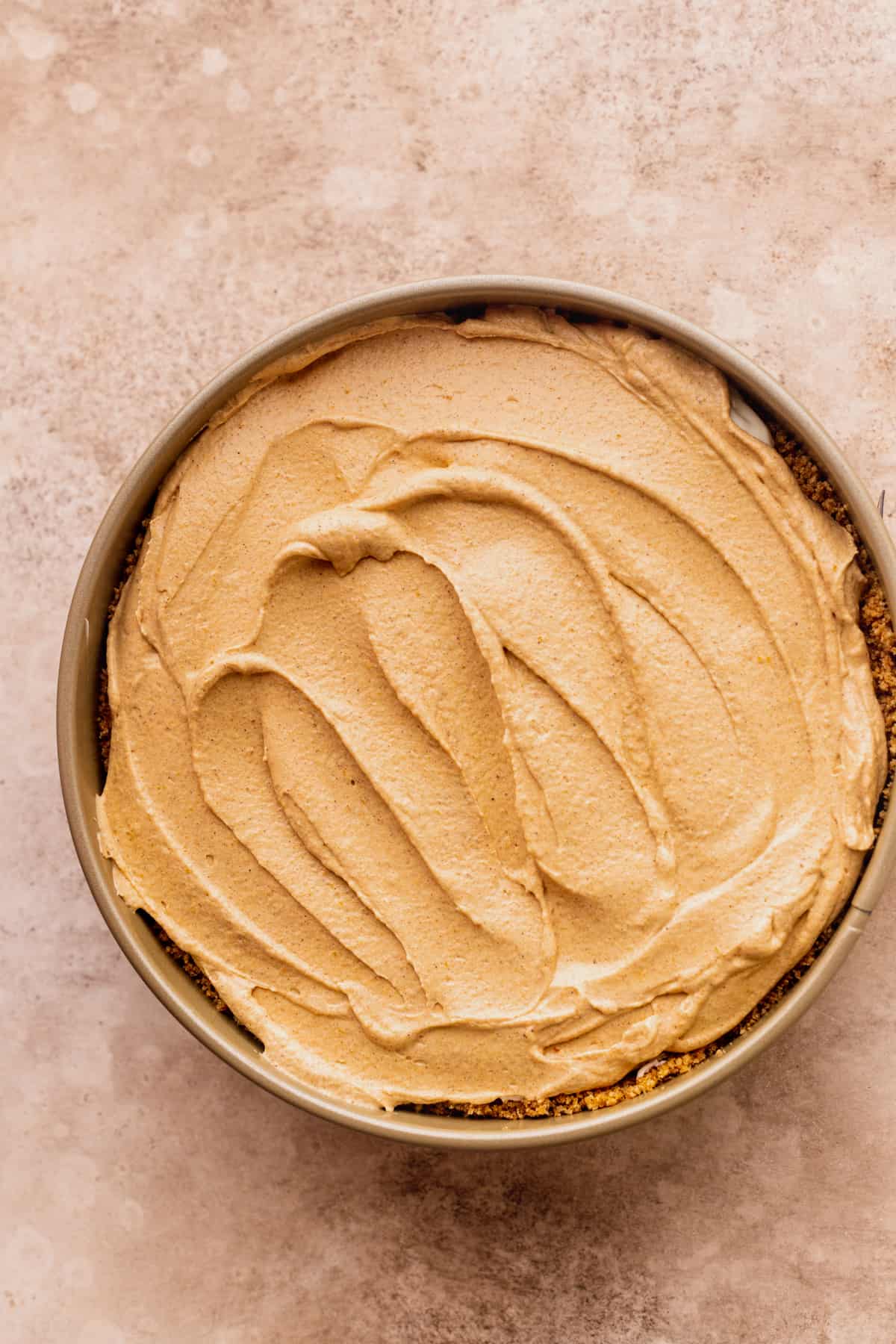 Layer of pumpkin batter on top of cheesecake.