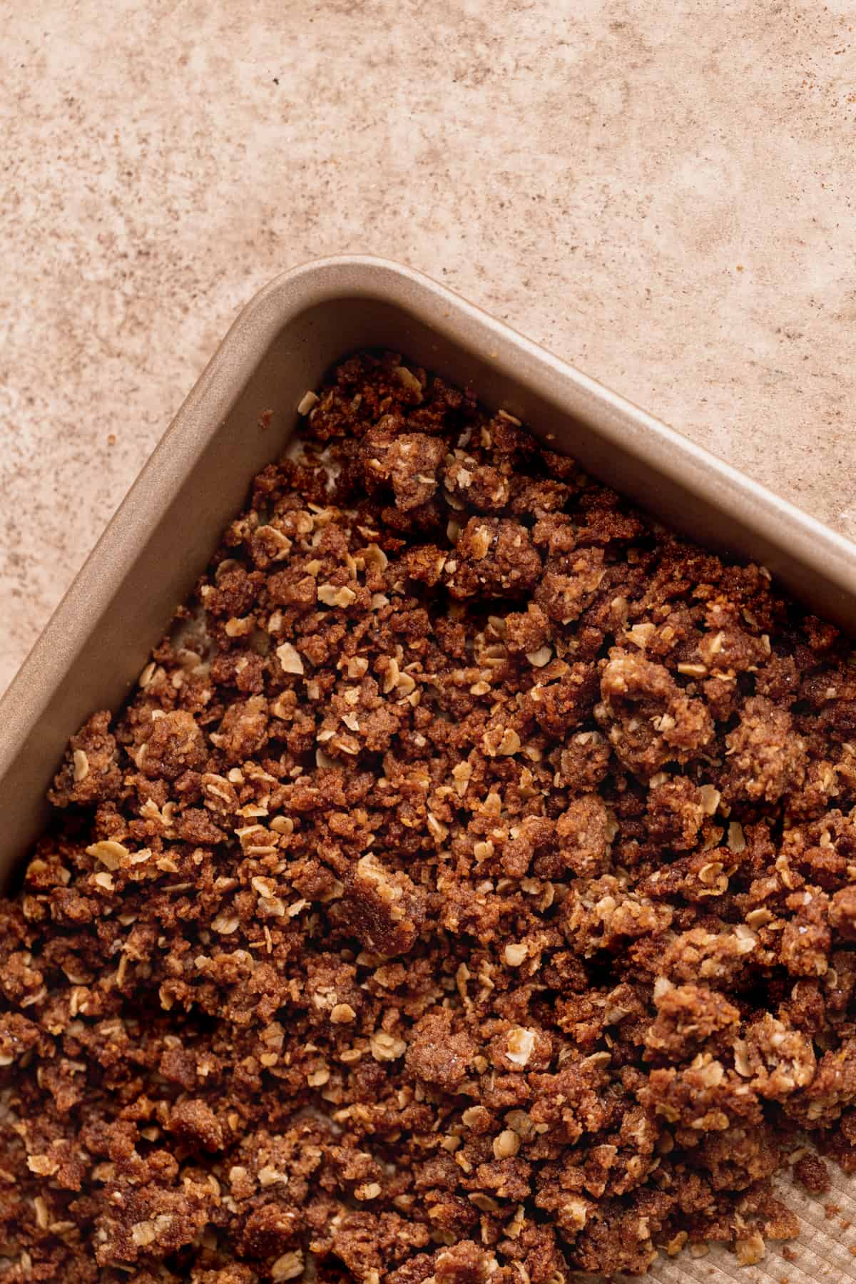 Cinnamon crumble on a cookie sheet.