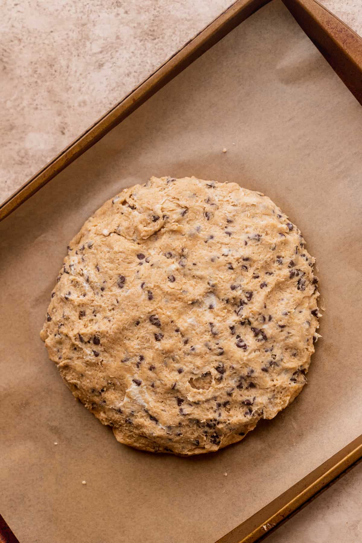 Scone dough on a cookie sheet.