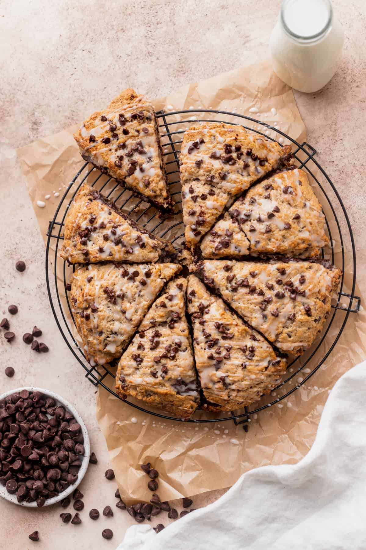 Chocolate chip stuffed scones on a wire rack.