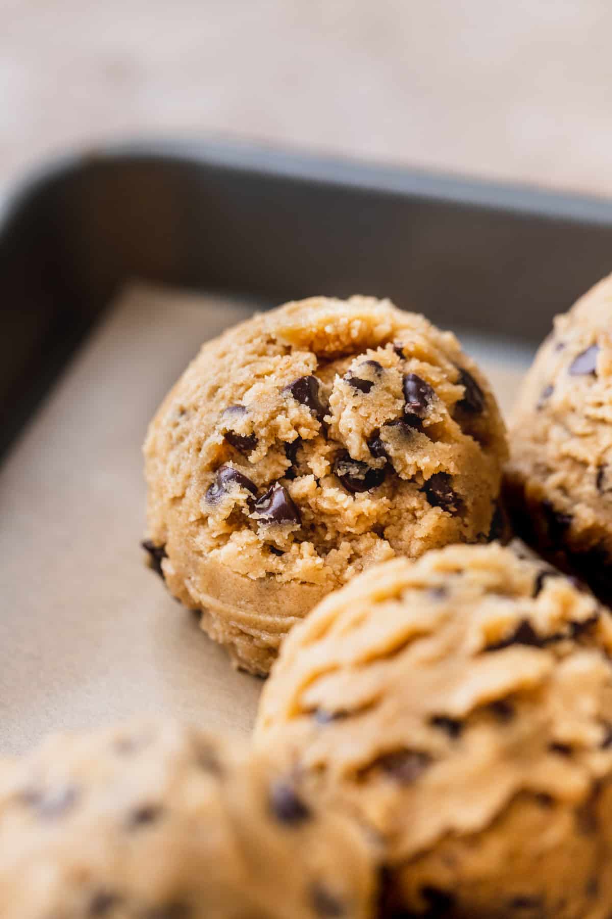 Cookie dough ball on a cookie sheet.