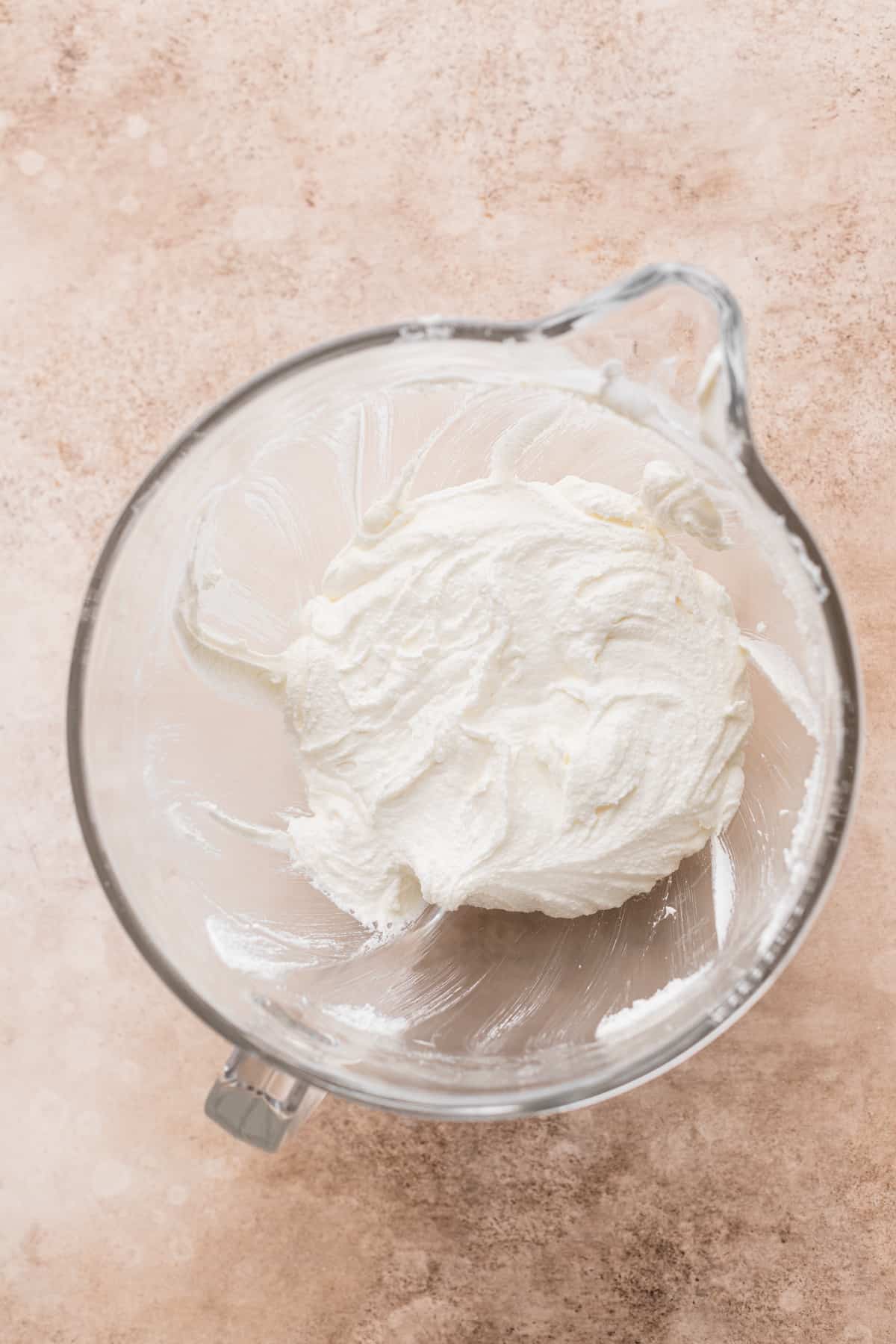 Whipped butter and sugar in a bowl.