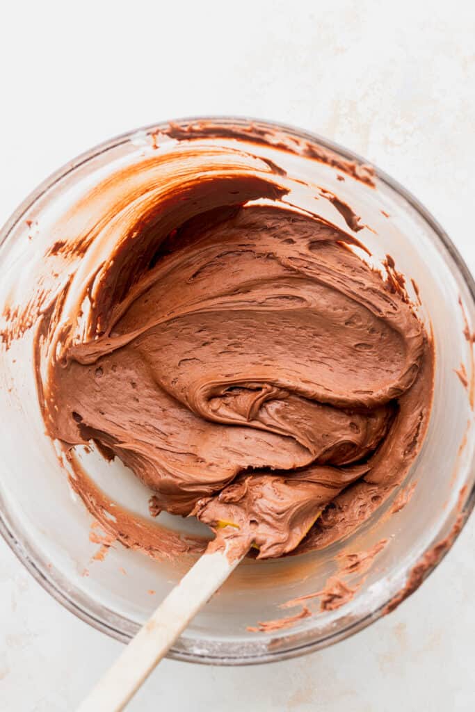 Chocolate Nutella frosting in a glass bowl.