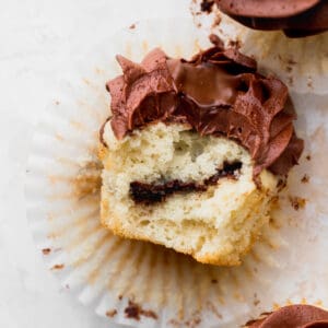 Bite missing from easy vanilla Nutella cupcakes.