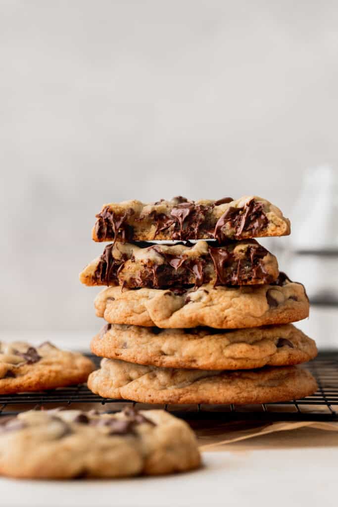 Stack of cookies with one cookie split in half.