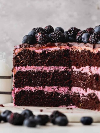 Layered blueberry chocolate cake split open.