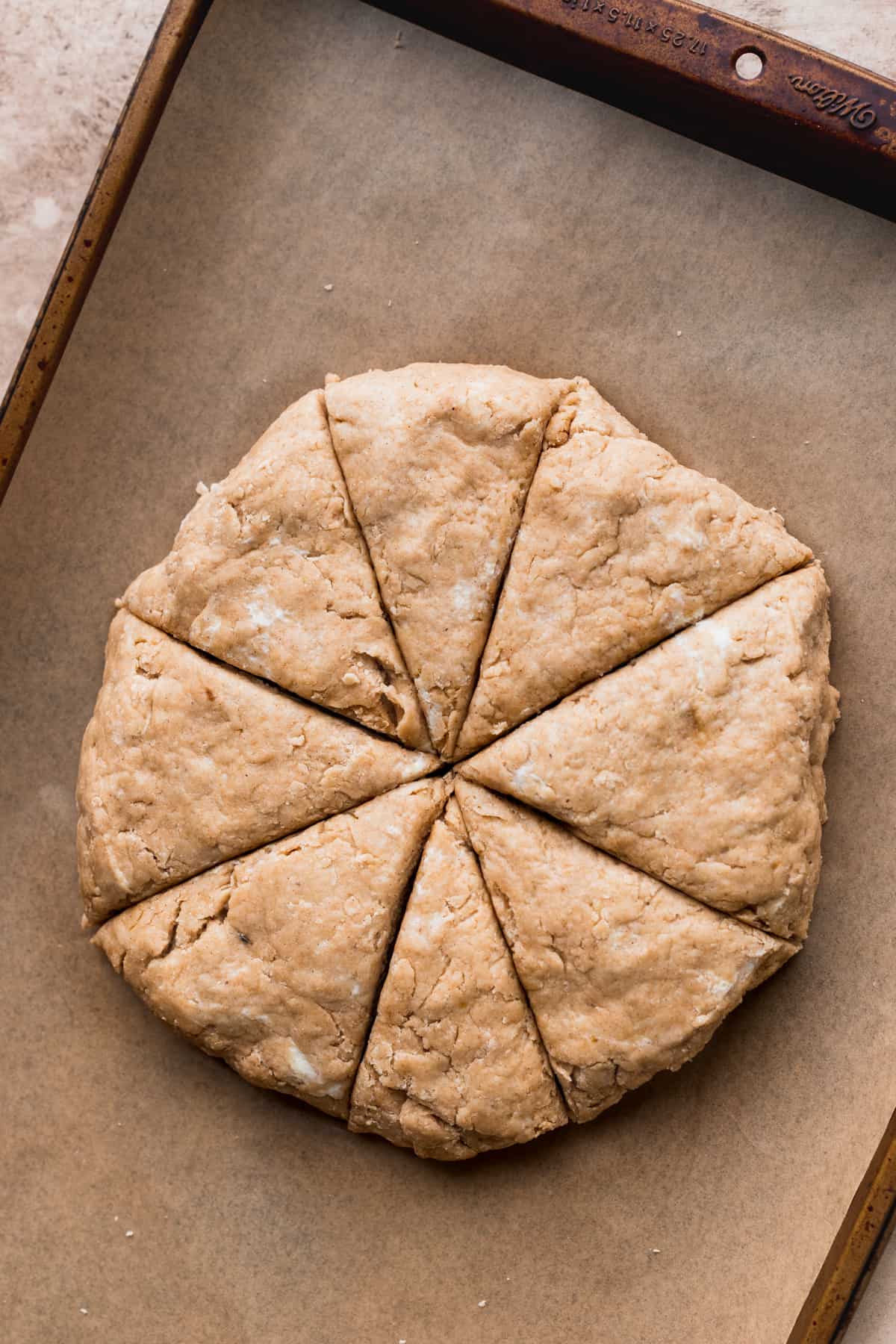 Scone dough on parchment paper.