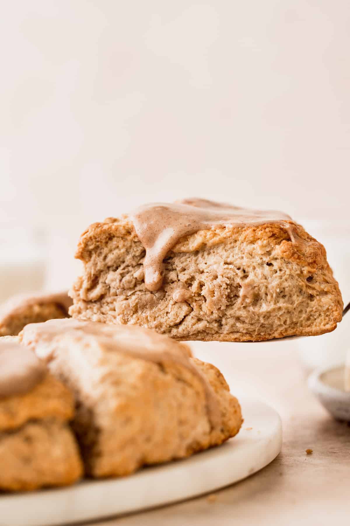 Taking out a scone out of the scone pile.