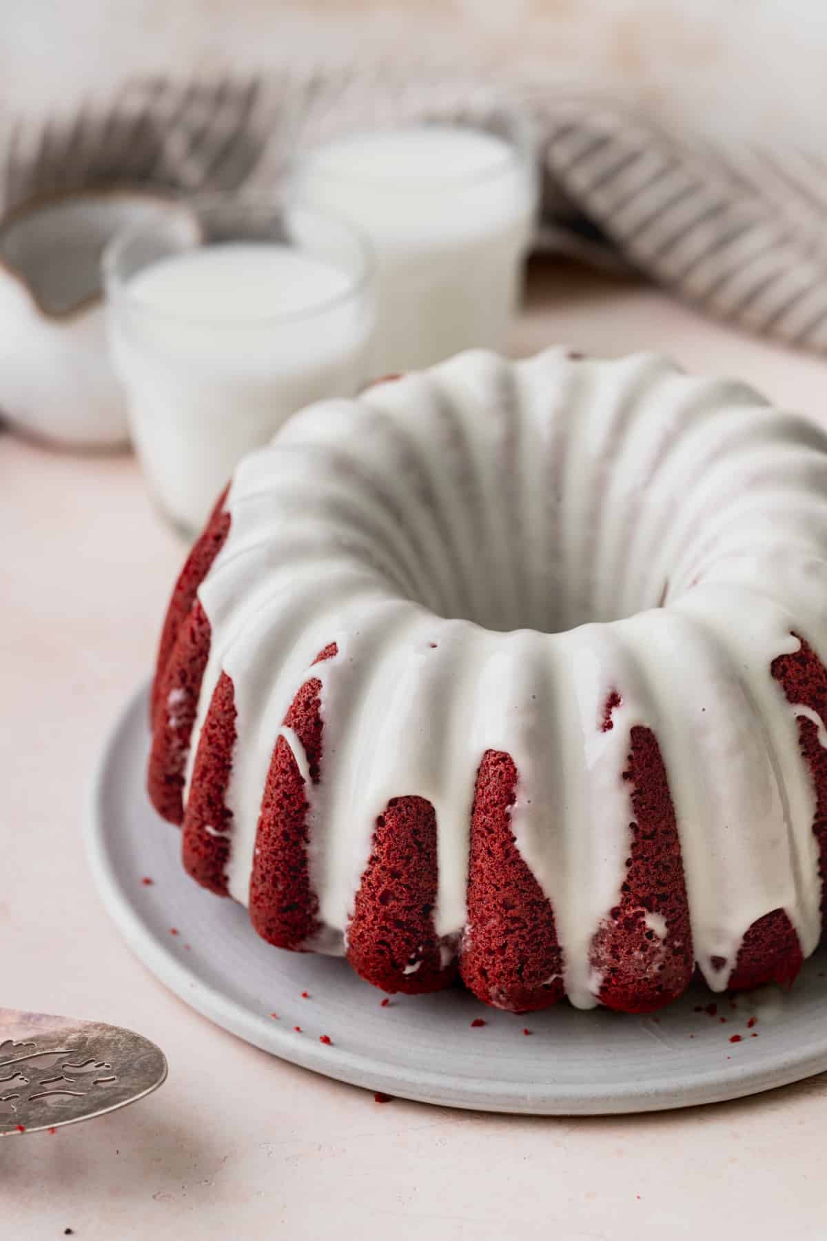 Red velvet bundt cake on a platter.