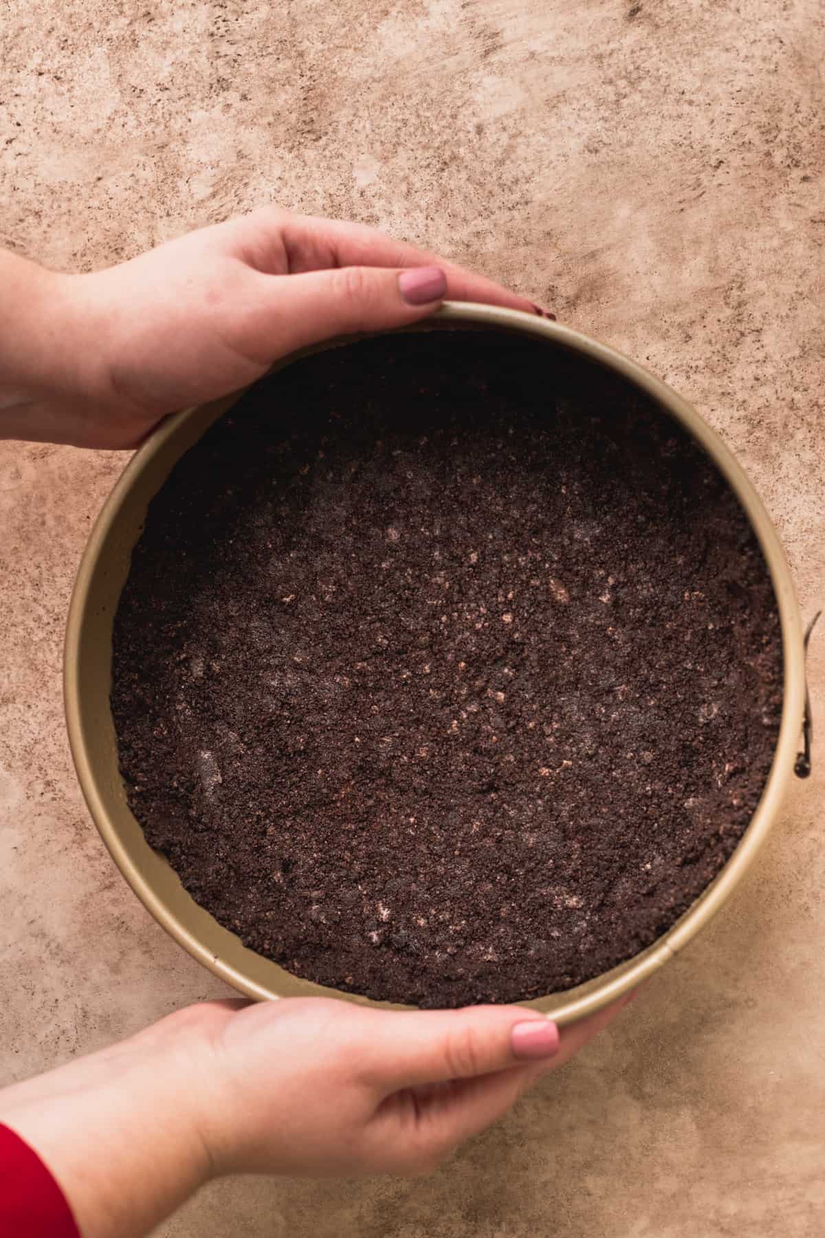 Oreo crust in the springform pan.