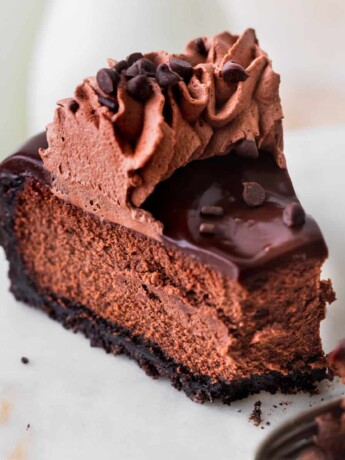 Close up of triple chocolate cheesecake slice.