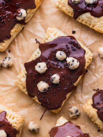 Chocolate cookie dough pop tarts on parchment paper.