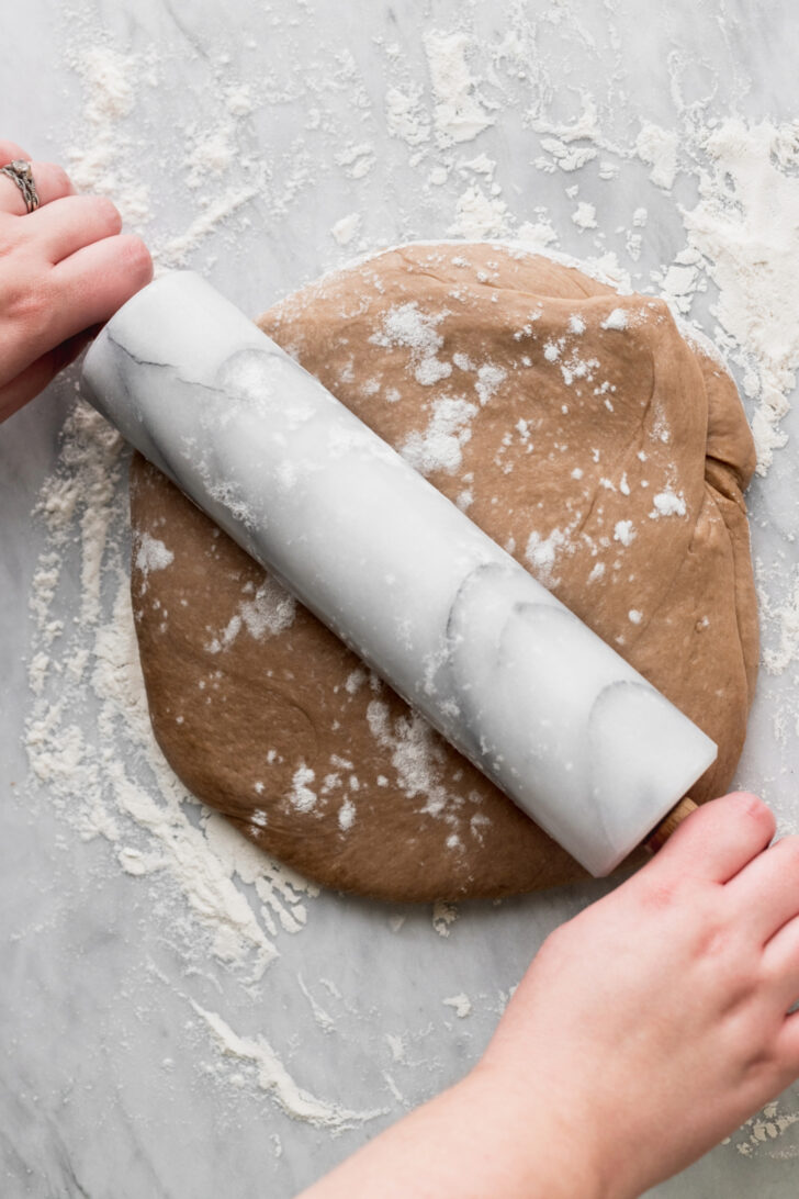 Rolling out the dough.