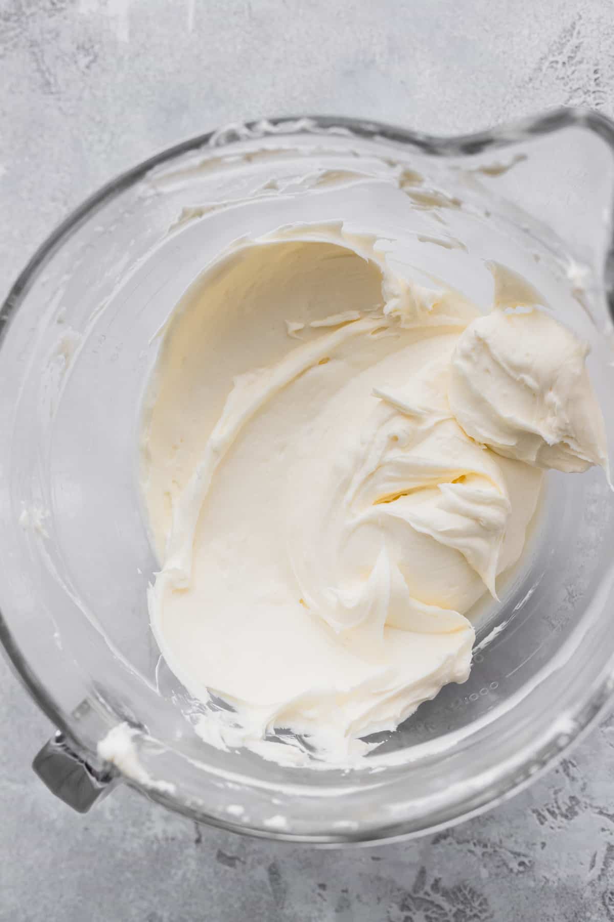 Beaten cream cheese and sugar in the bowl.