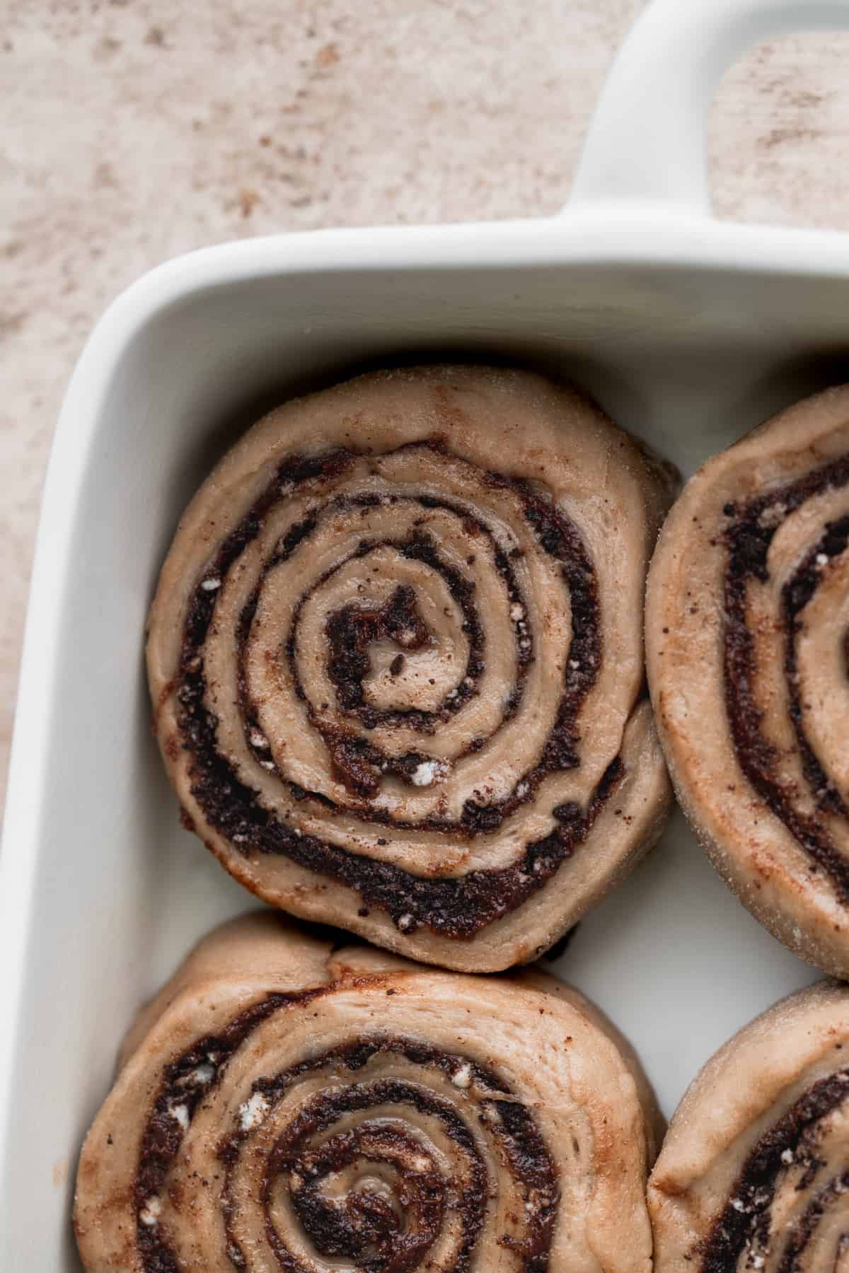 Close up of raw cinnamon roll in a platter.